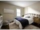 Well-lit bedroom with stylish decor, iron bed frame, and decorative rug at 1014 Shannon Ave, Indianapolis, IN 46201