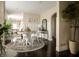 Bright dining area featuring a round table, white chairs, and elegant decor at 1014 Shannon Ave, Indianapolis, IN 46201