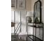 Nicely decorated dining room with modern mirror and table at 1014 Shannon Ave, Indianapolis, IN 46201