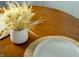 Close-up of dining table displaying flower decorations and table settings at 1014 Shannon Ave, Indianapolis, IN 46201