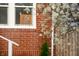 Window view on the brick exterior with decorative sign at 1014 Shannon Ave, Indianapolis, IN 46201
