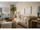 Comfortable living room with natural light, modern decor, and seamless flow into the dining area at 1014 Shannon Ave, Indianapolis, IN 46201