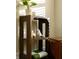 Living room decor showcasing a wooden shelf with decorative objects and a houseplant at 1014 Shannon Ave, Indianapolis, IN 46201