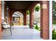 Inviting arched brick porch with stylish seating and decorative lanterns at 1014 Shannon Ave, Indianapolis, IN 46201