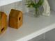 Decorative shelf highlighting modern decor with greenery and wooden accents at 1014 Shannon Ave, Indianapolis, IN 46201