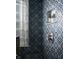 Shower design featuring decorative blue tile, glass blocks, and a recessed shelf at 1014 Shannon Ave, Indianapolis, IN 46201