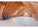 Unfinished attic space showcasing exposed wooden beams and ample room for storage or customization at 10333 E 211Th St, Noblesville, IN 46062