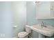 Clean half-bathroom with pedestal sink and toilet, maximizing space and convenience at 10333 E 211Th St, Noblesville, IN 46062
