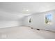 Bright and airy bedroom with neutral carpet, two windows, and white walls providing a blank canvas at 10333 E 211Th St, Noblesville, IN 46062