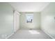 Cozy bedroom with light green walls, neutral carpet, closet, and a window, ready for personalization at 10333 E 211Th St, Noblesville, IN 46062