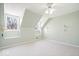 Cozy bedroom with sloped ceilings and natural light, creating a comfortable and inviting space at 10333 E 211Th St, Noblesville, IN 46062