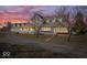 Stately gray home with a welcoming front porch and well-manicured lawn at 10333 E 211Th St, Noblesville, IN 46062