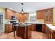 Charming kitchen with wood cabinets, center island, and modern appliances at 10333 E 211Th St, Noblesville, IN 46062