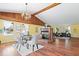 Inviting living room with a cozy fireplace, wood floors, and bright windows at 10333 E 211Th St, Noblesville, IN 46062