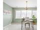 Bright home office featuring natural light, stylish decor, and a modern chandelier for a comfortable workspace at 10333 E 211Th St, Noblesville, IN 46062