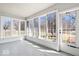 Enclosed sunroom featuring multiple windows offering beautiful views, bright and airy atmosphere at 10333 E 211Th St, Noblesville, IN 46062