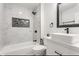 Modern bathroom featuring marble tile, sleek fixtures, and a rectangular sink at 1533 Harlan St, Indianapolis, IN 46203
