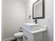 Modern half-bathroom with vessel sink, elegant mirror, and contemporary fixtures at 1533 Harlan St, Indianapolis, IN 46203