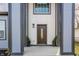 Inviting front entry featuring a beautifully designed door and stylish potted plants at 1533 Harlan St, Indianapolis, IN 46203