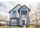 Stunning two-story home with modern design, large windows and manicured landscaping at 1533 Harlan St, Indianapolis, IN 46203