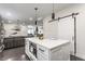 Open-concept kitchen featuring a central island with seating and seamless living room integration at 1533 Harlan St, Indianapolis, IN 46203