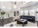 Bright living room with soaring ceilings, modern furniture, and ample natural light at 1533 Harlan St, Indianapolis, IN 46203
