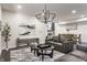 Comfortable living room with leather sofa, decorative rug, and open view to dining area at 1533 Harlan St, Indianapolis, IN 46203