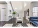 Bright living room with soaring ceilings, modern furniture, and ample natural light at 1533 Harlan St, Indianapolis, IN 46203