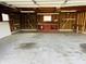 Spacious garage with ample storage space, work bench, and concrete flooring at 1607 Elmhurst Dr, Indianapolis, IN 46219
