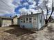 Charming home with a back door, multiple windows, and a small concrete step at 1632 W 17Th St, Anderson, IN 46016