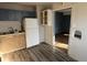 This kitchen features laminate countertops, wooden cabinets, and a refrigerator at 1632 W 17Th St, Anderson, IN 46016