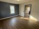 This living room features hardwood floors, natural light, and neutral walls at 1632 W 17Th St, Anderson, IN 46016