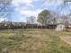 Large backyard with a shed, swing set, and plenty of space for outdoor activities at 1840 Hibiscus Dr, Indianapolis, IN 46219