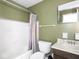Bathroom features a shower-tub combo, toilet and vanity with mirror and a window at 1840 Hibiscus Dr, Indianapolis, IN 46219