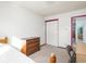 Cozy bedroom with a dresser, closet, neutral walls, and plush carpet flooring at 1840 Hibiscus Dr, Indianapolis, IN 46219
