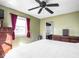 Bedroom featuring a large bed, multiple dressers, and a large window with curtains at 1840 Hibiscus Dr, Indianapolis, IN 46219
