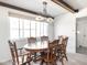Bright dining room with light fixture and view of the outside at 1840 Hibiscus Dr, Indianapolis, IN 46219