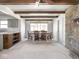 Open floor plan of dining room with wooden table and view to the living room at 1840 Hibiscus Dr, Indianapolis, IN 46219