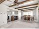Open floor plan of dining room with wooden table and view to the kitchen at 1840 Hibiscus Dr, Indianapolis, IN 46219