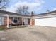 Inviting front porch with a bench, rocking chair, and a view of the home's exterior features at 1840 Hibiscus Dr, Indianapolis, IN 46219