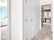 Hallway leading to a bedroom and a bathroom with carpeted floors at 1840 Hibiscus Dr, Indianapolis, IN 46219