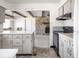 Bright kitchen featuring light cabinetry and modern appliances, seamlessly connecting to the living space at 1840 Hibiscus Dr, Indianapolis, IN 46219