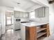 Spacious kitchen with an island and seamless flow into the adjacent room at 1840 Hibiscus Dr, Indianapolis, IN 46219