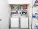 Neat laundry room with washer, dryer, and lots of storage at 1840 Hibiscus Dr, Indianapolis, IN 46219