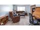 Comfortable living room featuring a plush sectional sofa, recliner and cozy carpeting at 1840 Hibiscus Dr, Indianapolis, IN 46219