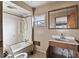 Bathroom features a shower-tub combination, a sink with a vanity, and a toilet at 2123 N F St, Elwood, IN 46036