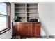 Wooden cabinet with open shelves and natural light from a nearby window at 2123 N F St, Elwood, IN 46036