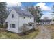 Exterior elevation showing the home, garage, and driveway at 2123 N F St, Elwood, IN 46036