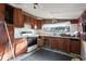 Vintage kitchen with older appliances, lots of cabinet space, and a double bowl sink at 2123 N F St, Elwood, IN 46036