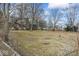 View of a vacant lot showcasing trees and sky on a sunny day at 2123 N F St, Elwood, IN 46036